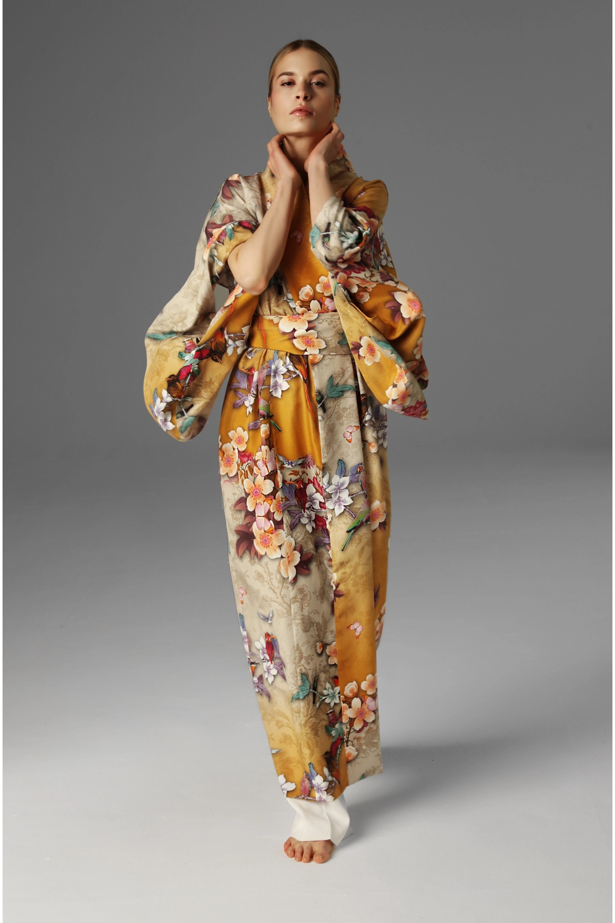 Front view of a kimono made of matte silk with a rich floral pattern.