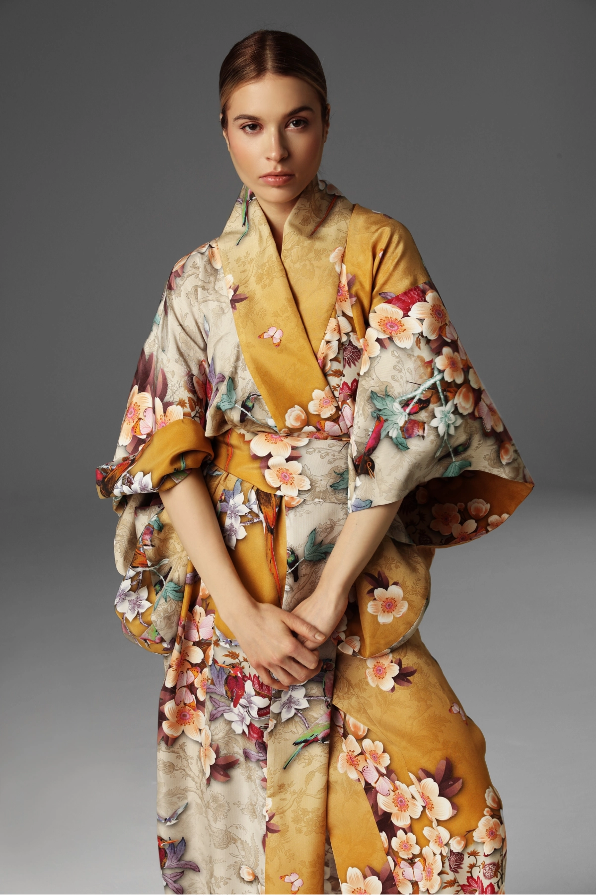 View of a model presenting the upper part of a silk kimono by Monika Adamska.