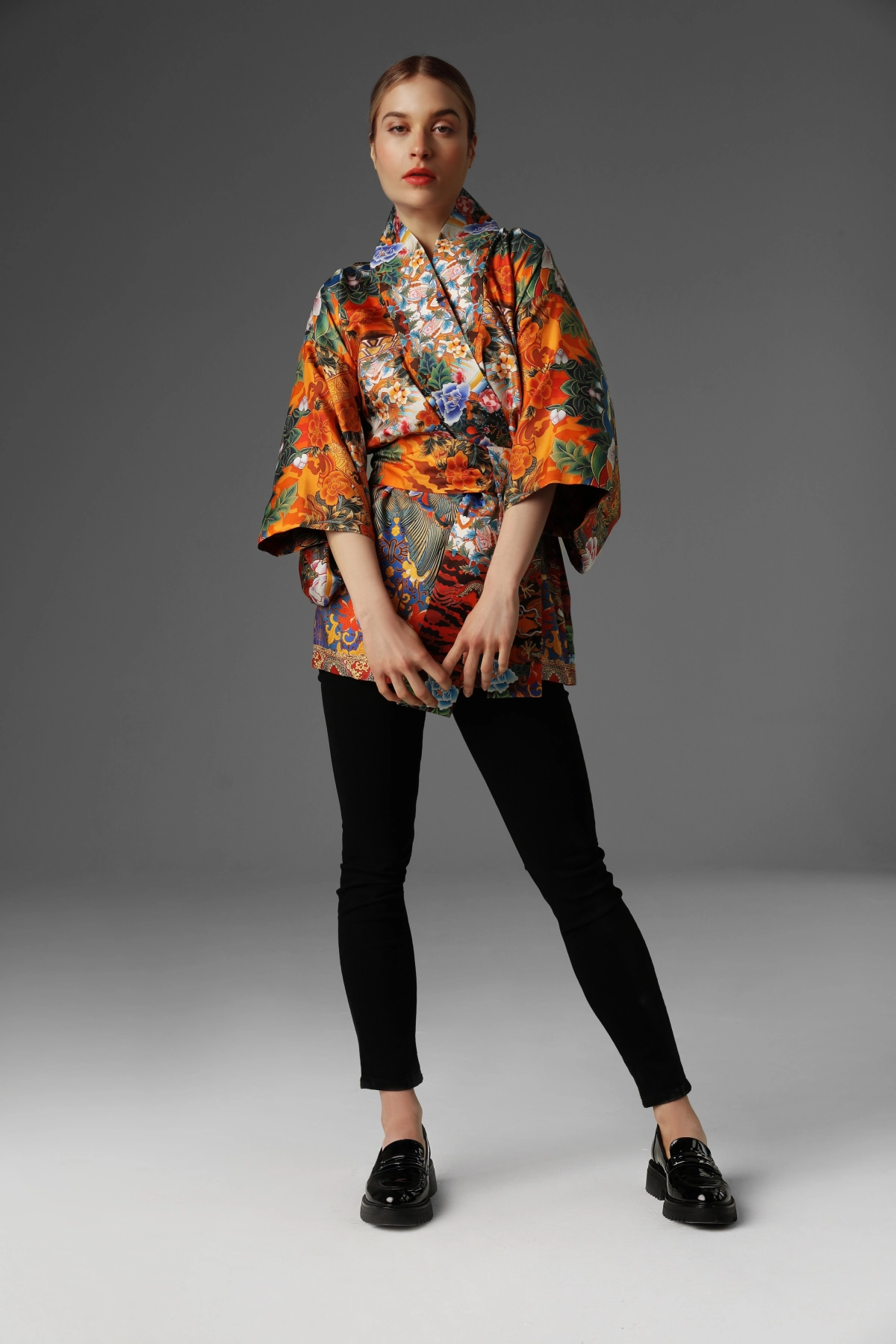 A view of a model presenting a short silk kimono by Monika Adamska.