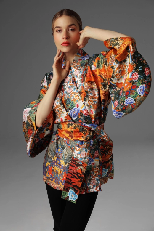 A view of a model presenting a short kimono and traditional Japanese sleeves.