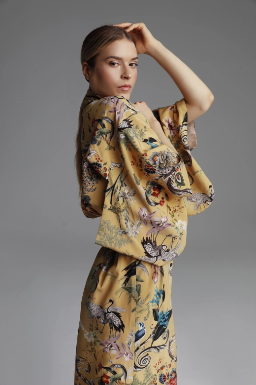 A photograph showing a close-up of the kimono sleeve and fabric pattern.