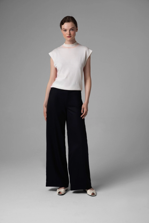 Monika Adamska navy wool trousers, wide legs, model showing the fit from the front