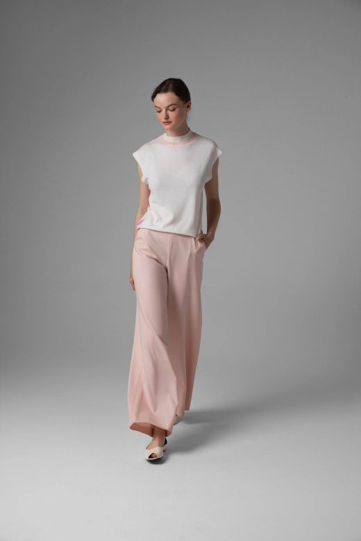 Monika Adamska pastel pink wool trousers, wide legs, front view on the model