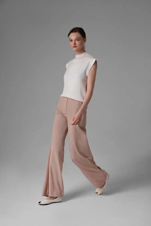 Monika Adamska beige wool trousers, wide legs, model showing front view