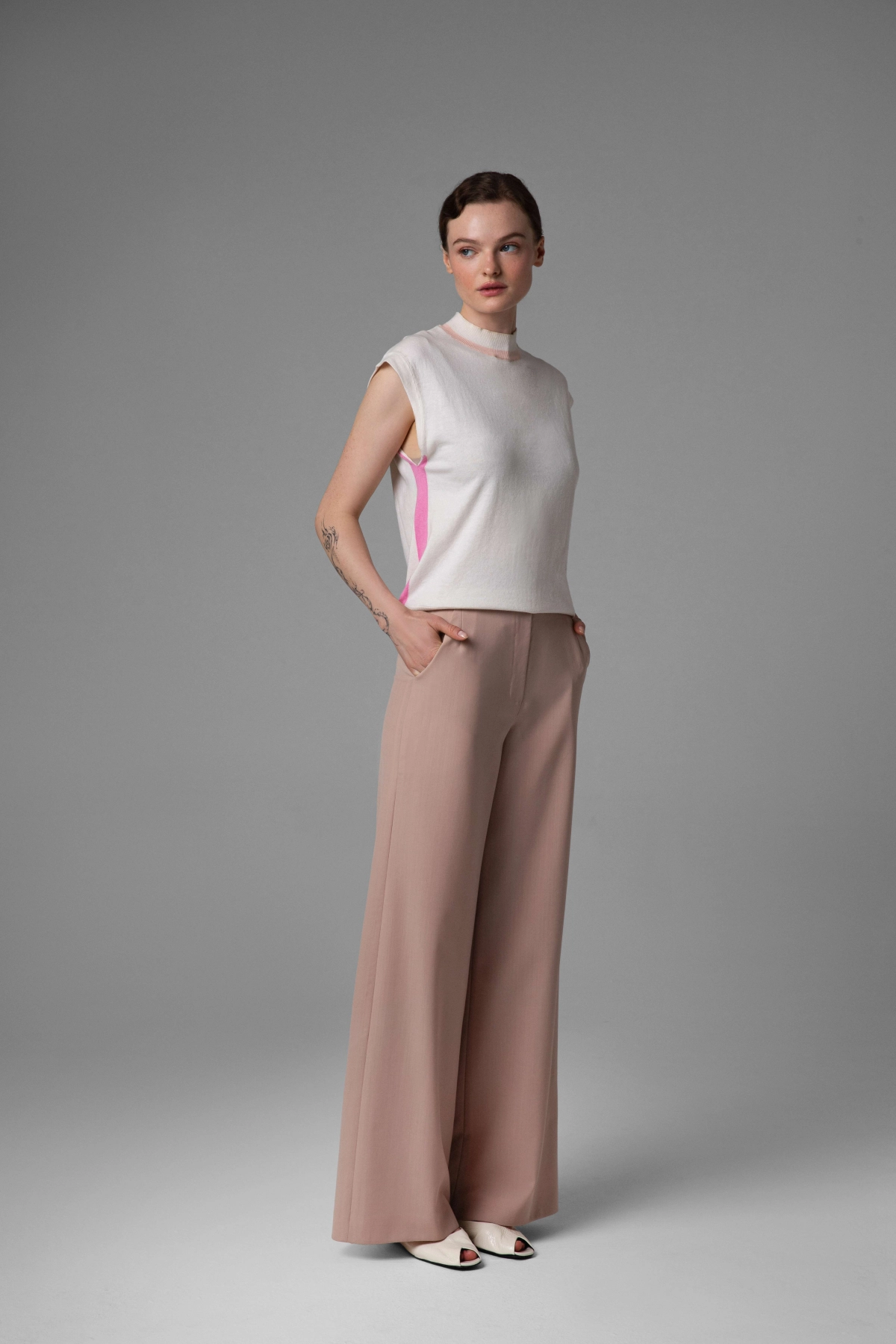 Beige wool trousers Monika Adamska, wide legs, model side view