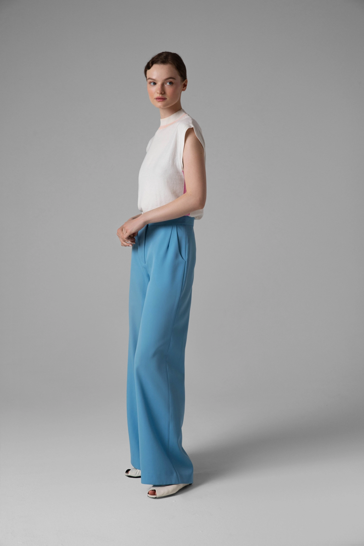 Blue lambswool trousers Monika Adamska, wide-leg, model side view