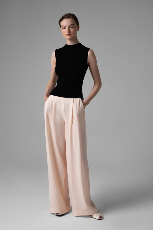 Monika Adamska light summer wool trousers, wide legs, model front view