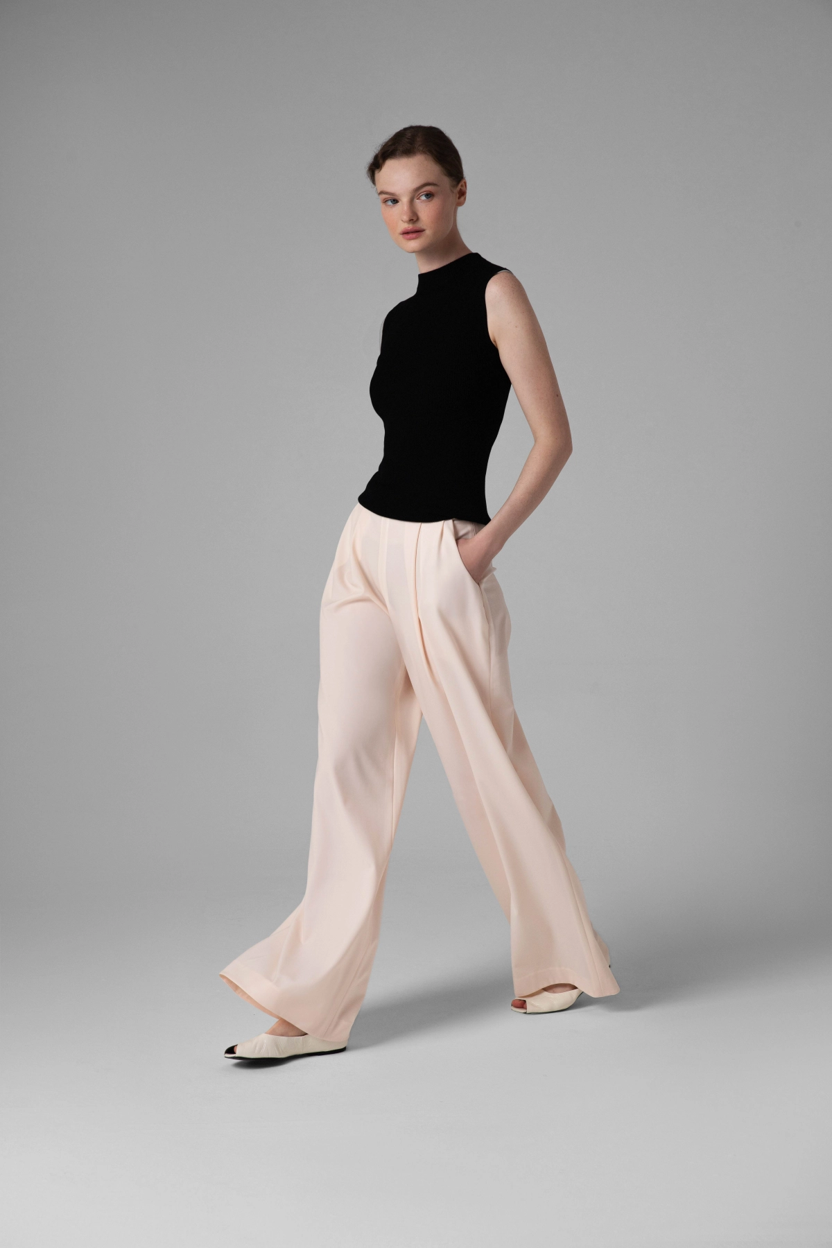Light summer wool trousers Monika Adamska, wide legs, side view on model