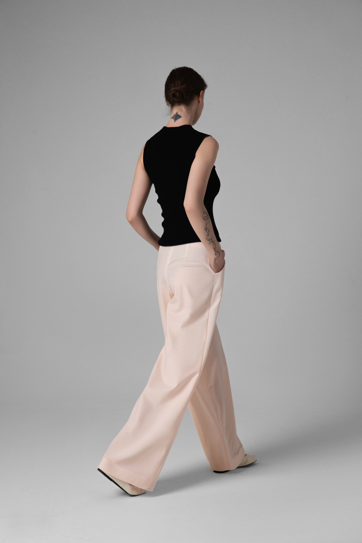 Monika Adamska light summer wool trousers, wide legs, back view on model