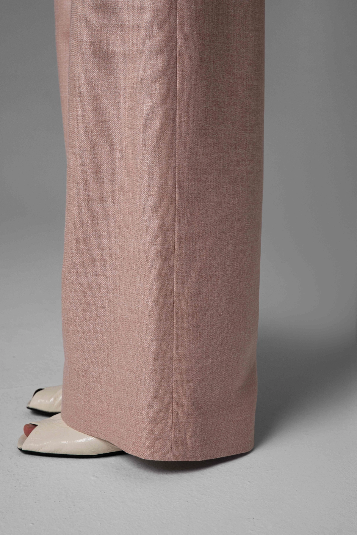 Light noble fabric trousers Monika Adamska, wide legs, side view on model