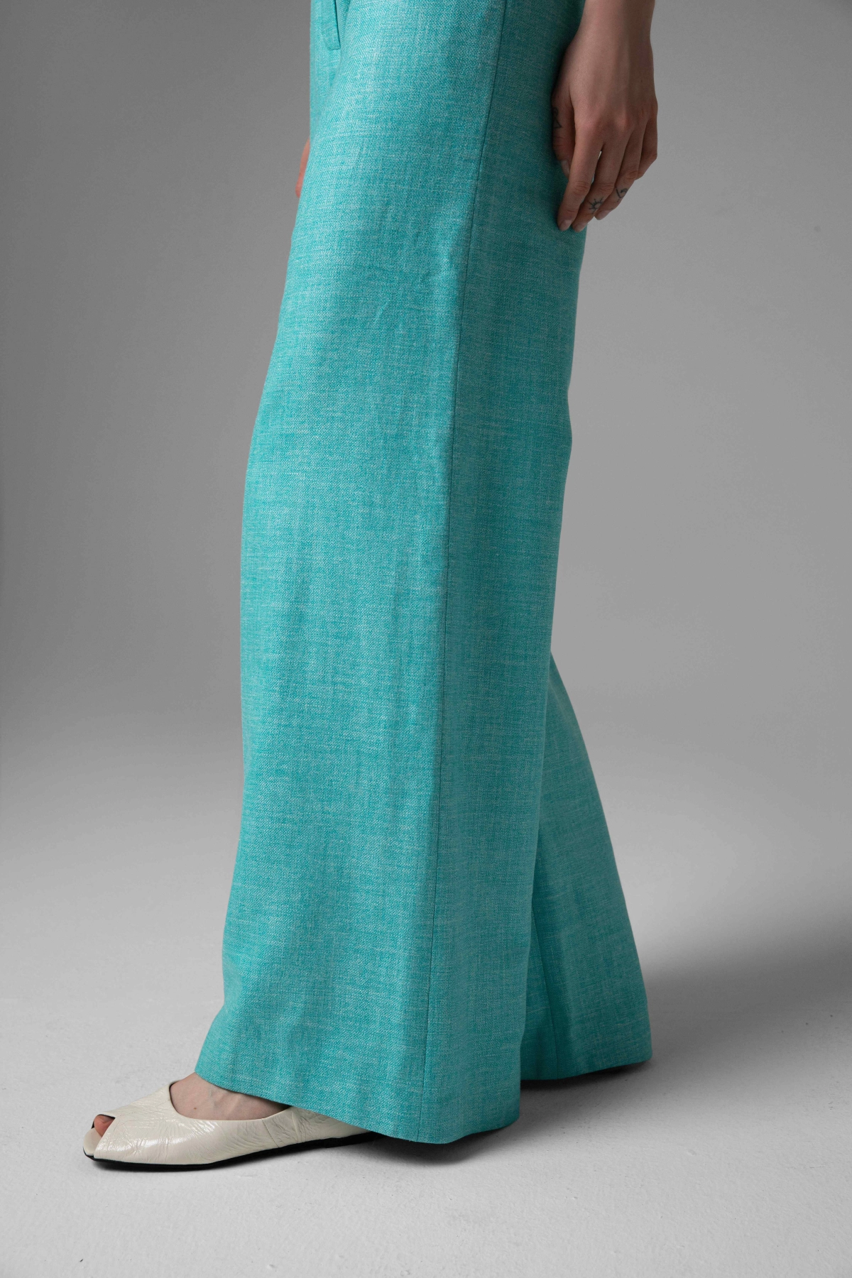 Turquoise trousers Monika Adamska, noble mélange fabric, side leg detail