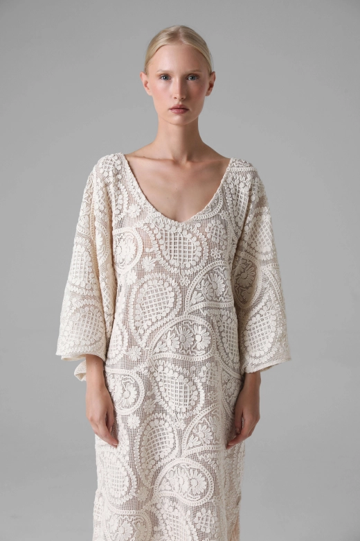 Model wearing crochet look summer dress, cotton openwork, front view