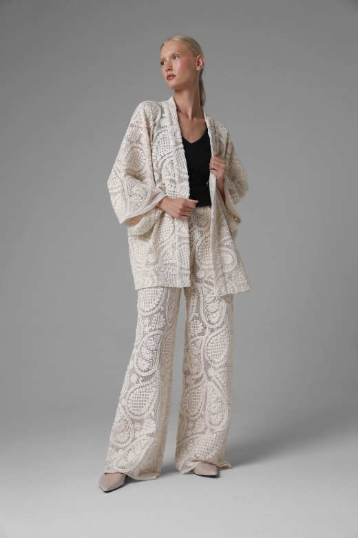 Short openwork paisley kimono, wide sleeves, styled with black top