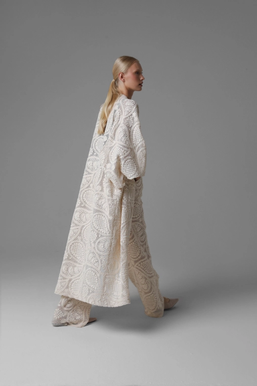 Back view of long paisley crochet look kimono, open openwork fabric texture