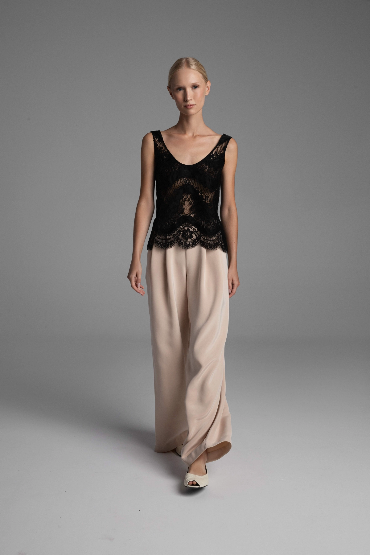 Monika Adamska wide-leg silk trousers in a delicate nude beige with a hint of rose.