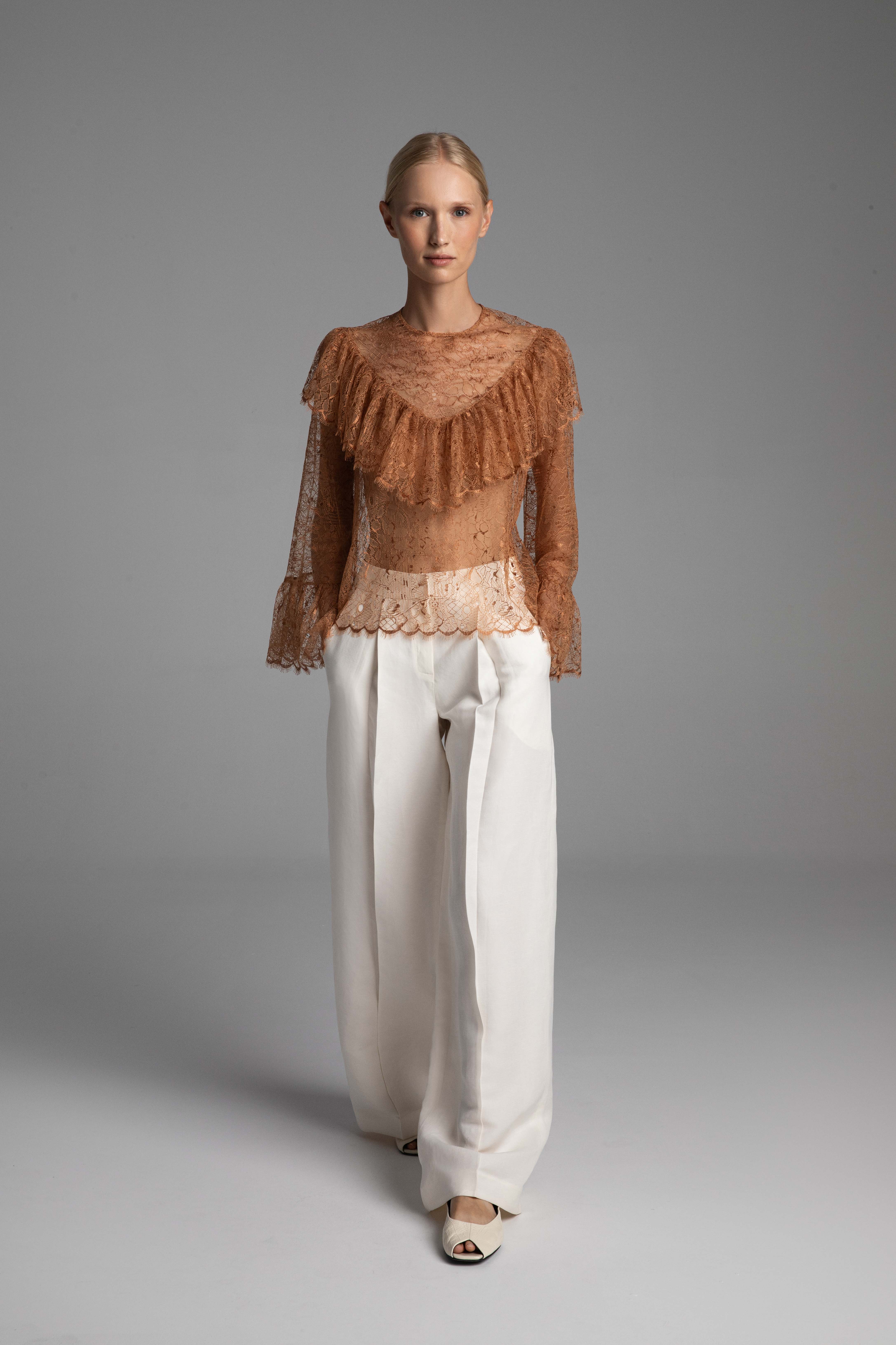 Video showcasing the fluidity of the noble French lace and how the densely gathered ruffle by Monika Adamska provides comfortable coverage during movement.