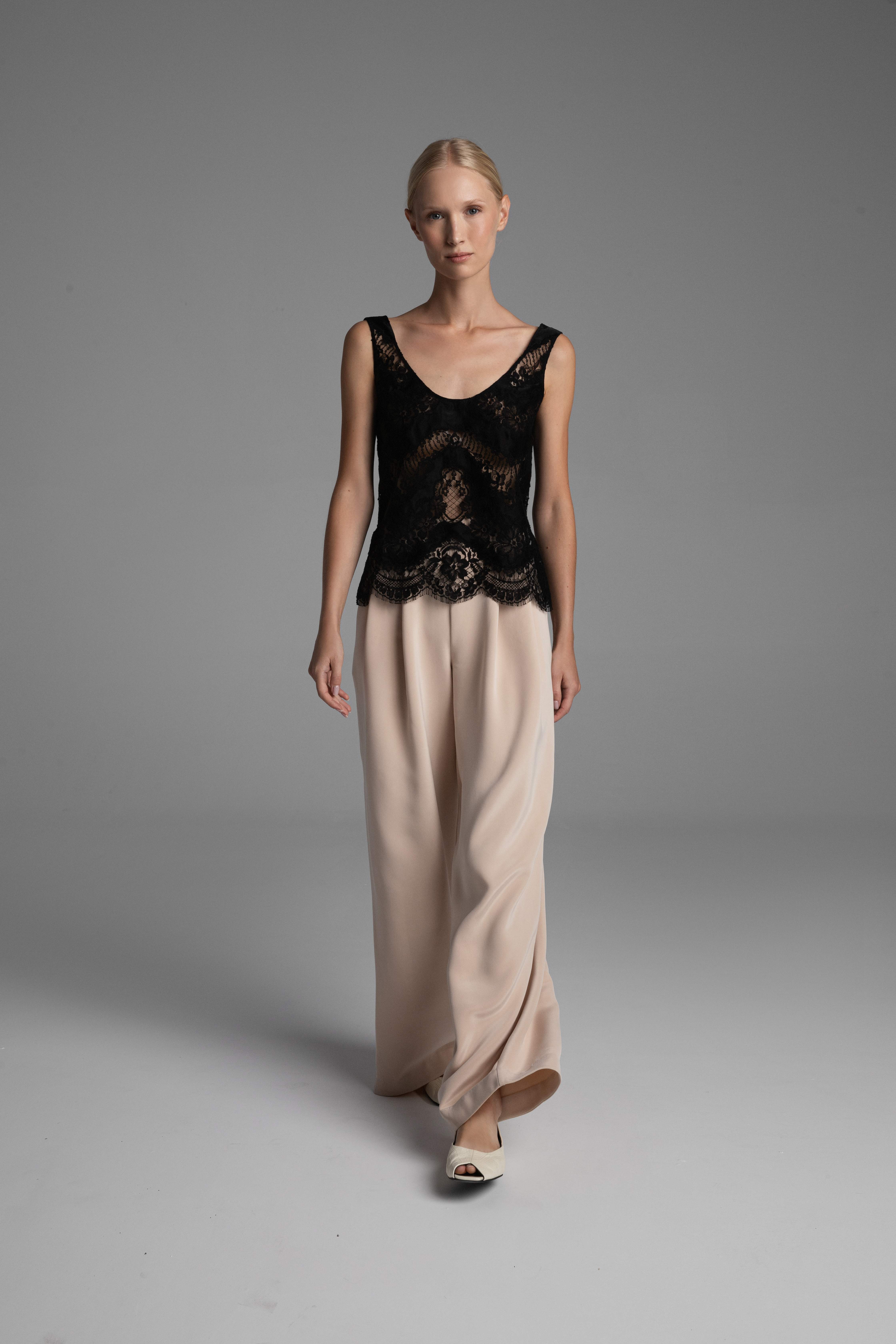 The pliability and weight of the matte sand-washed silk crepe in motion – the drape of the wide legs.
