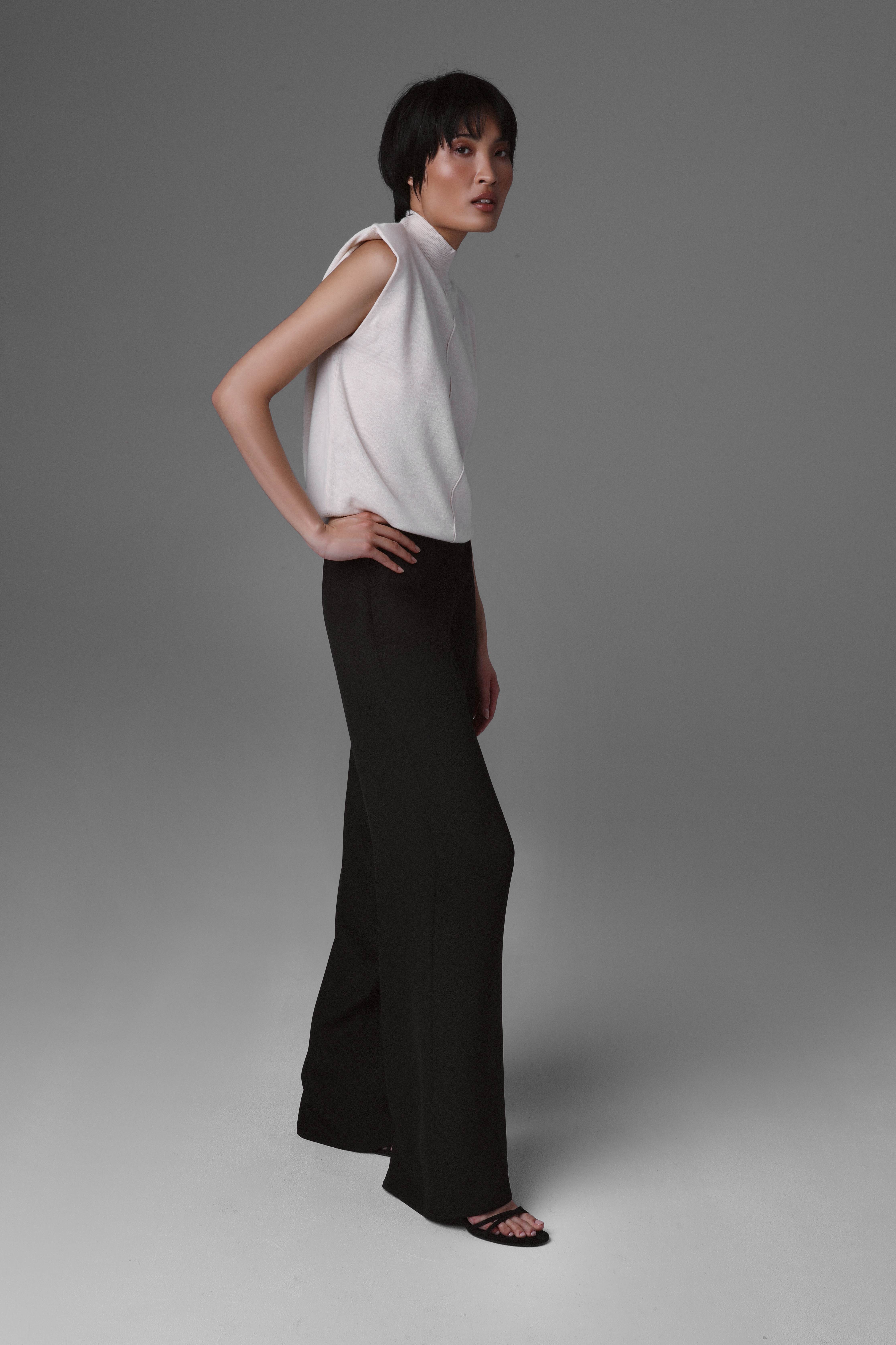 The movement of wide-leg silk crepe trousers – showcasing the fluid fabric structure during turns and strides.